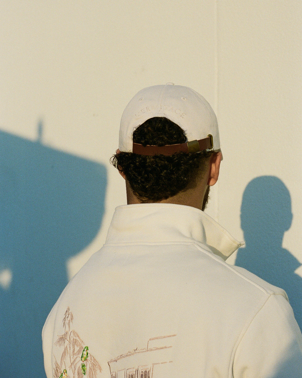 Man wearing the L'Ermitage Beverly Hills x Dinner Service NY dad hat.