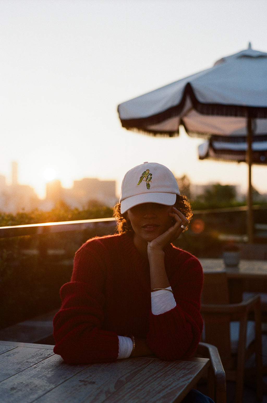 Woman wearing the L'Ermitage Beverly Hills x Dinner Service NY dad hat.