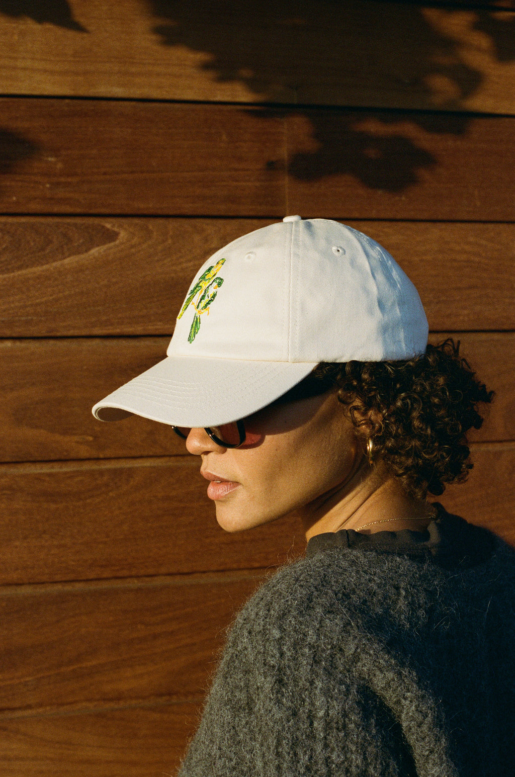 Woman wearing the L'Ermitage Beverly Hills x Dinner Service NY dad hat.