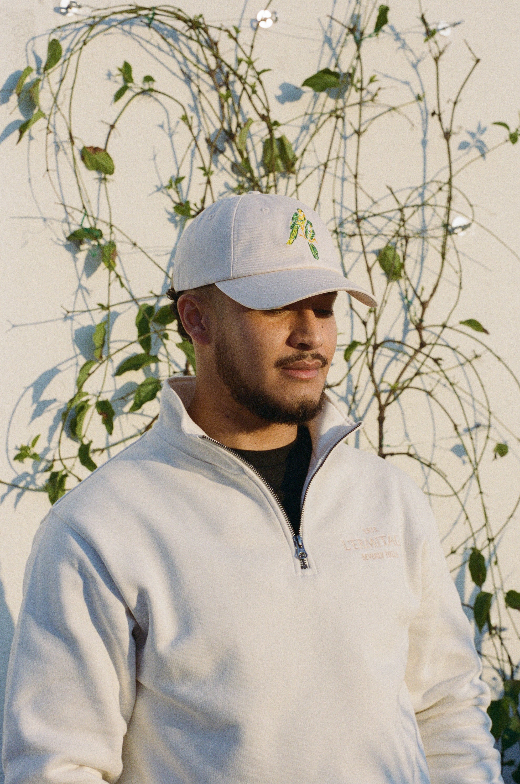 Man wearing the L'Ermitage Beverly Hills x Dinner Service NY dad hat.